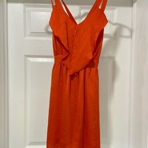BCBG open back dress in coral orange with pockets! Hidden zipper and pockets.